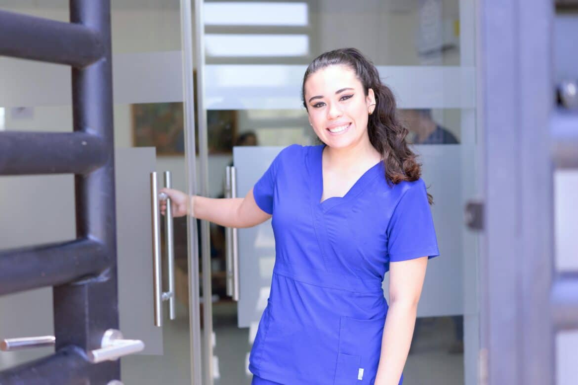 Woman in blue scrub suit smiling