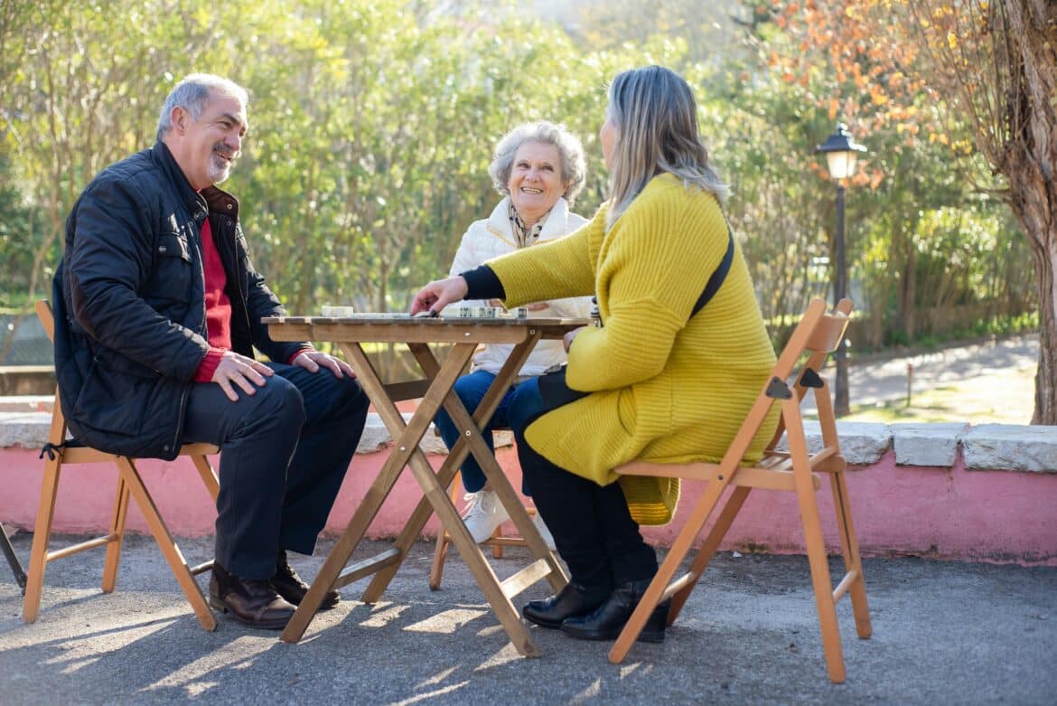 People playing a board game outdoors