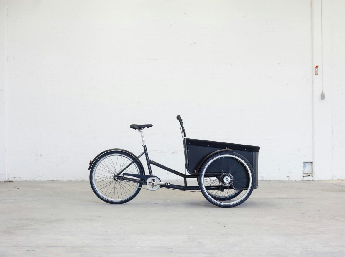 Shallow photography of black steel adult trike